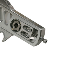 Close-up of Billet V1 Swingarm (Softail 2018+) axle adjuster area, highlighting detailed machining and high-performance hardware.